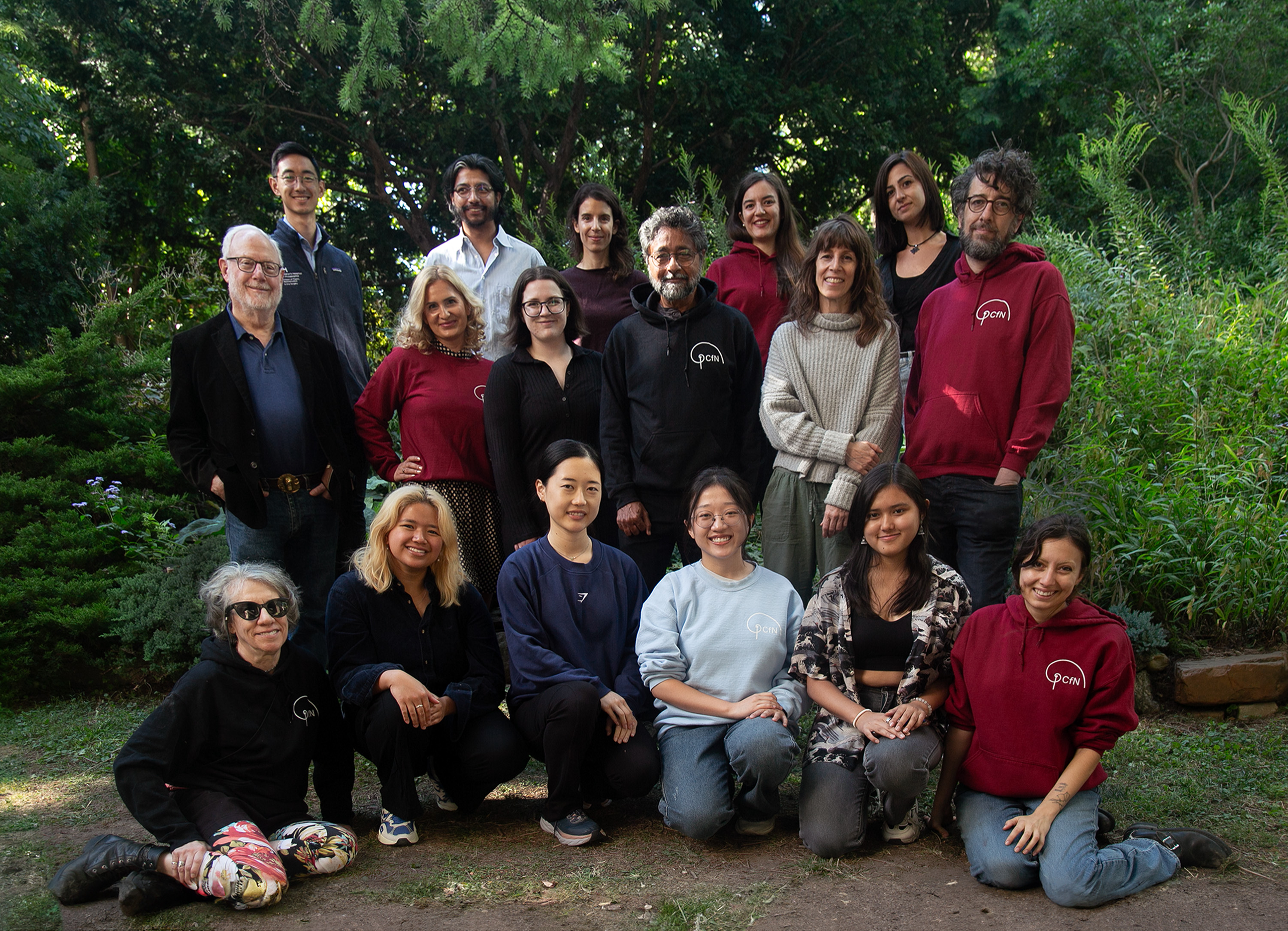 Lab group photo in front of PCfN logo